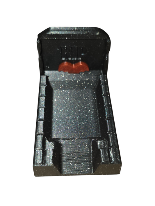 A Gothic styled feeding platforms that look like Grave stone with Red bats